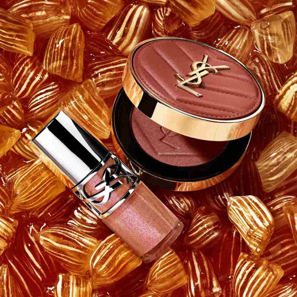 YSL-Schimmerrouge und Gloss auf bernsteinfarbenen Bonbons