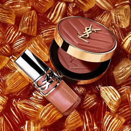 YSL-Schimmerrouge und Gloss auf bernsteinfarbenen Bonbons