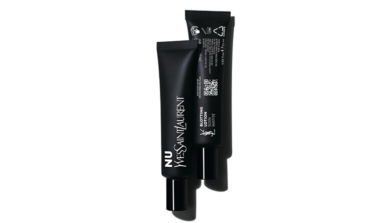 Two sleek black tubes of YSL beauty products, positioned upright with a minimalist white background.
