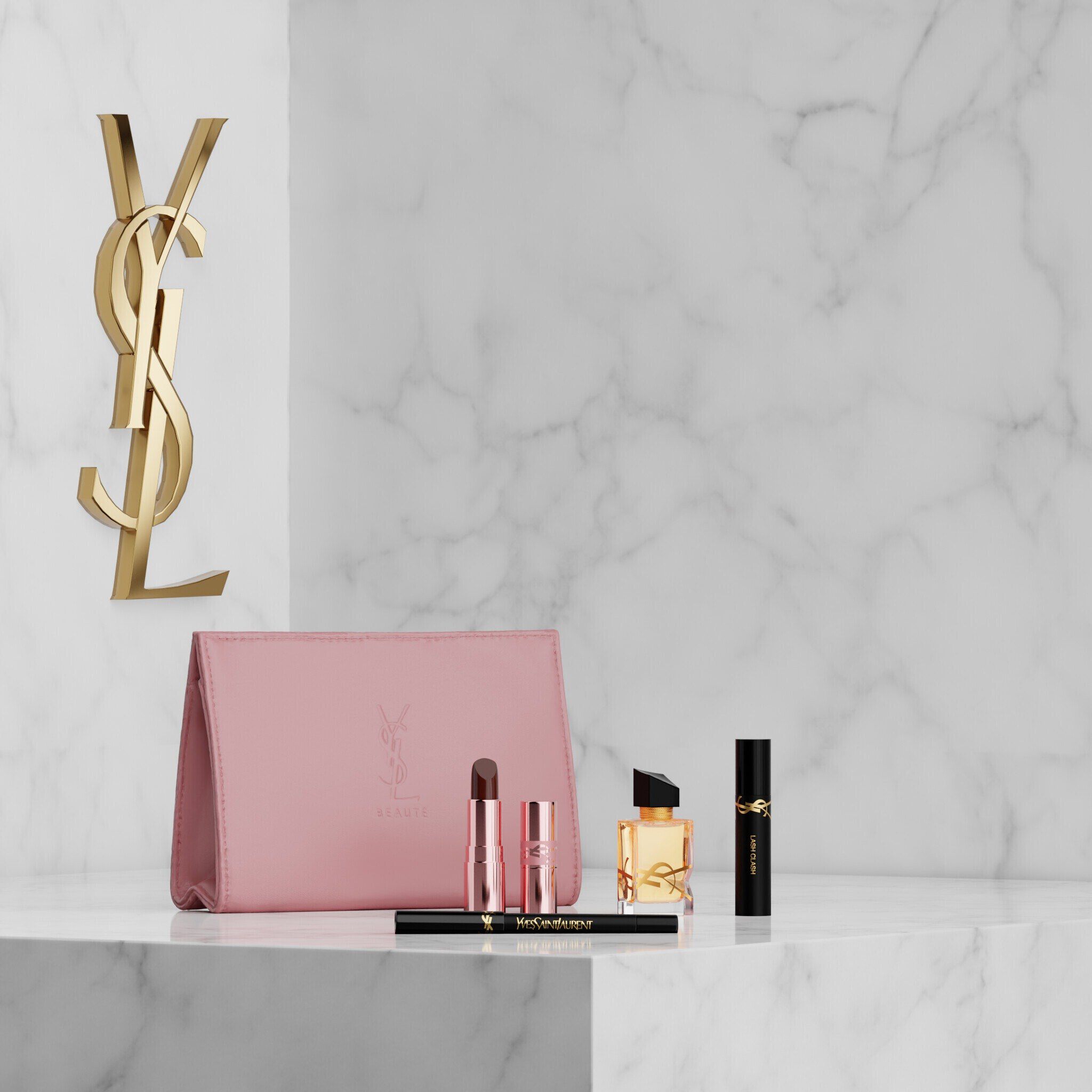 YSL-Beauty-Set mit rosa Taschchen, Lippenstift, Eyeliner, Mascara und Mini-Parfum auf einer Marmorablage.