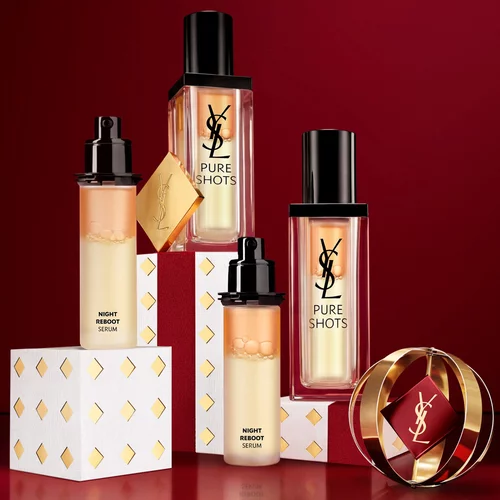 YSL Pure Shots Night Reboot-Serumflakons und festliche Verpackungen.