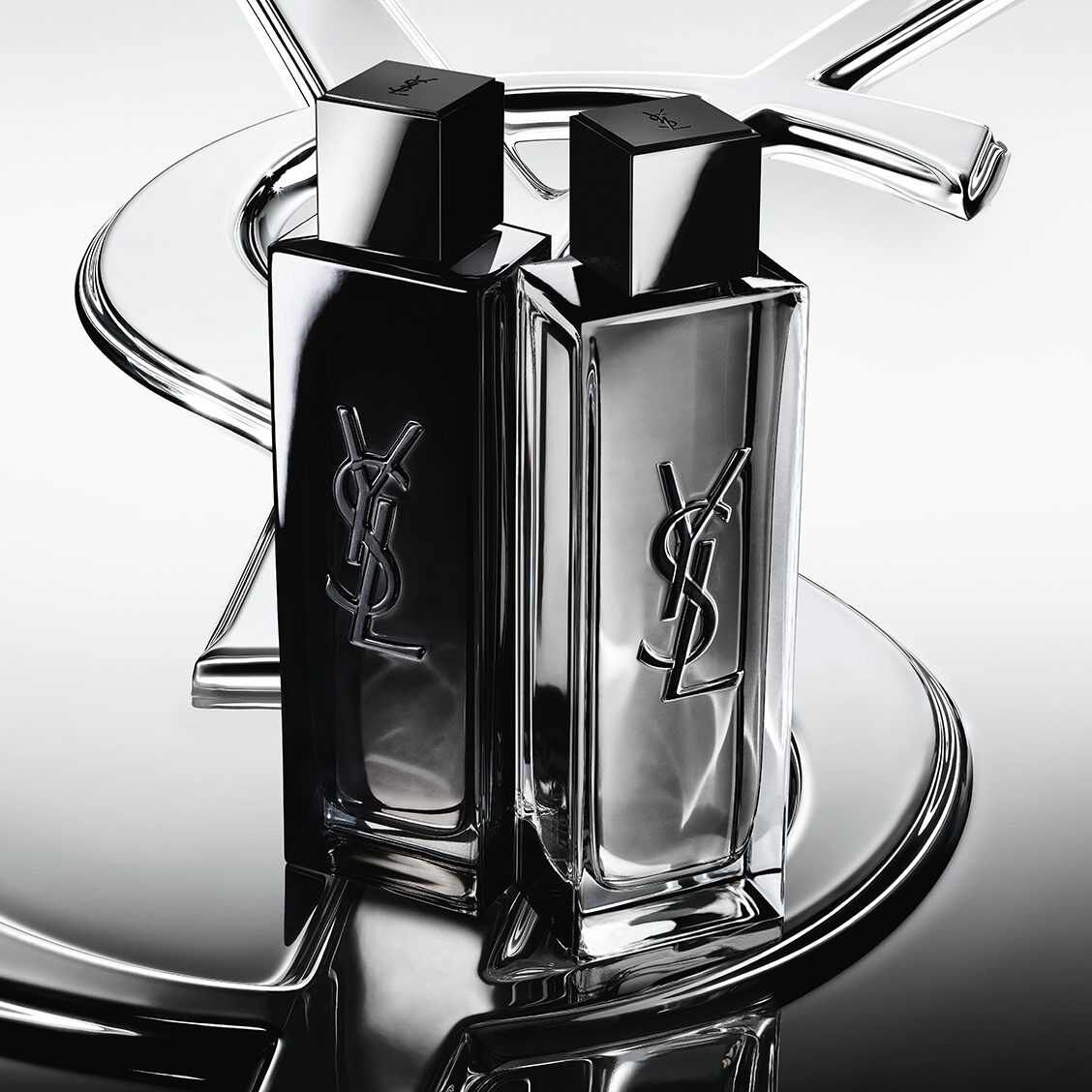 Zwei YSL-Parfumflakons in Schwarz und Silber