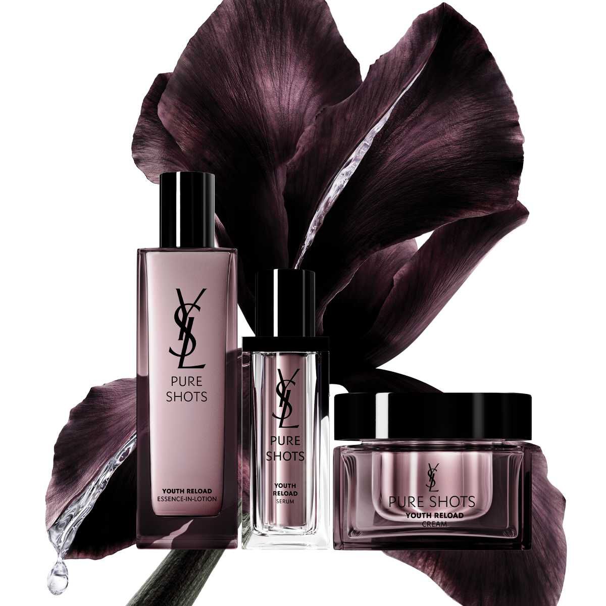 Produits de soin YSL Pure Shots devant un fond de fleur sombre.
