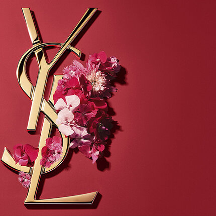 Goldenes YSL-Logo mit rosa Blumen auf rotem Grund